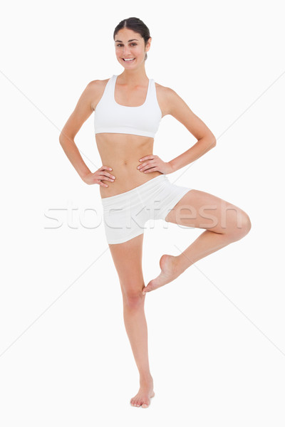 Subtire femeie yoga pozitie alb picioare Imagine de stoc © wavebreak_media