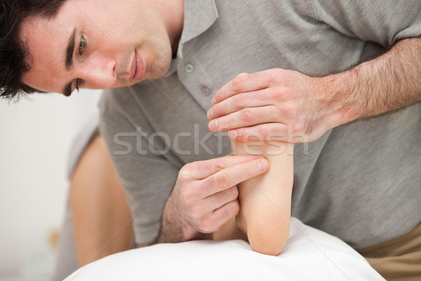 Chiropodist making a foot massage in a medical room Stock photo © wavebreak_media