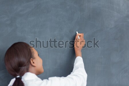 Stockfoto: Zwarte · vrouw · schrijven · Blackboard · glimlachend · klas · school