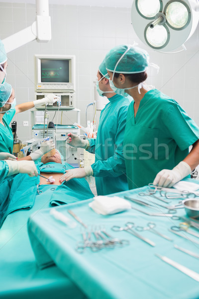Surgeons checking a monitor while operating Stock photo © wavebreak_media