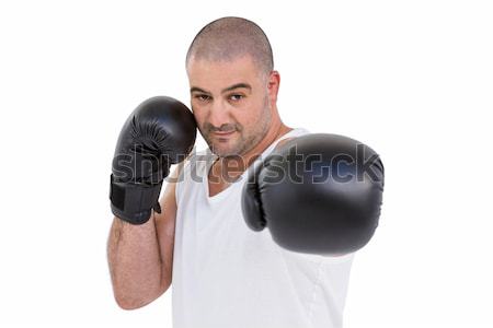Portrait of young male boxer punching Stock photo © wavebreak_media