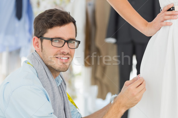 Male fashion designer adjusting dress on model Stock photo © wavebreak_media
