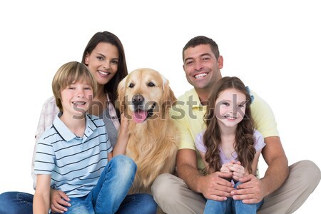 Porträt lächelnd Familie Sitzung zusammen Hund Stock foto © wavebreak_media