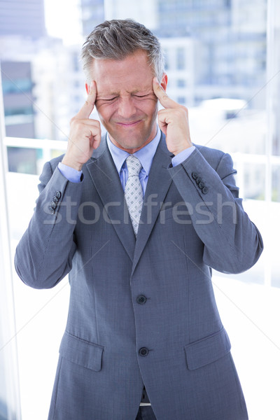 Businessman having a headache Stock photo © wavebreak_media