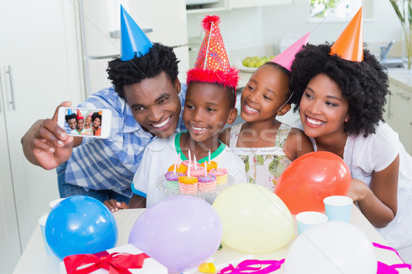 Happy family celebrating a birthday together Stock photo © wavebreak_media