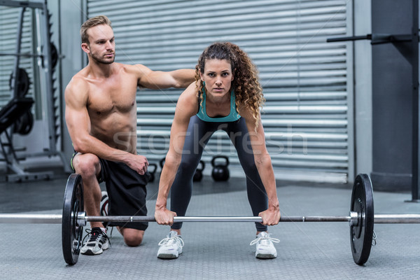 Attentif musculaire femme poids entraîneur [[stock_photo]] © wavebreak_media