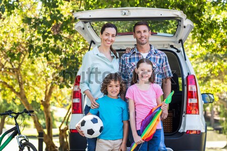 Family standing on the road against house outline in background Stock photo © wavebreak_media