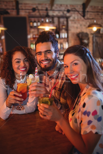 Portrait of young friends having drinks Stock photo © wavebreak_media