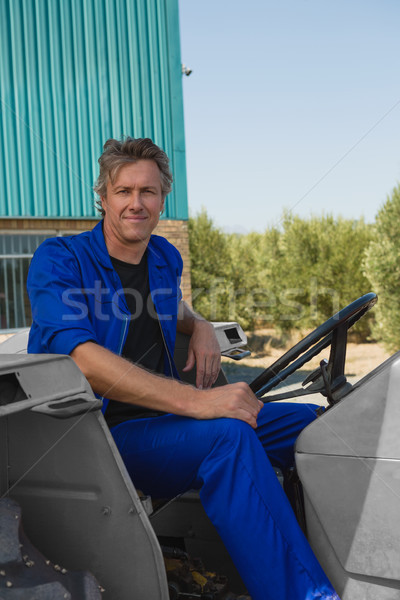 Worker sitting in tractor Stock photo © wavebreak_media
