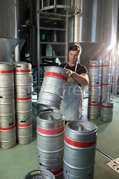 Male worker arranging kegs Stock photo © wavebreak_media