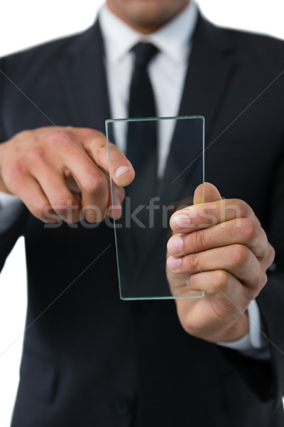 Mid section of businessman using transparent interface Stock photo © wavebreak_media