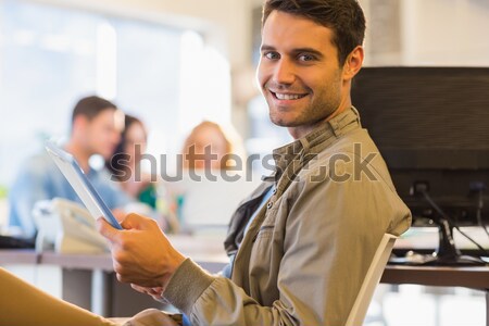 Portrait of smiling teacher with students in background Stock photo © wavebreak_media