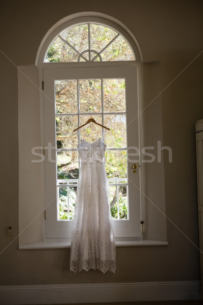 Wedding dress hanging on window in room Stock photo © wavebreak_media