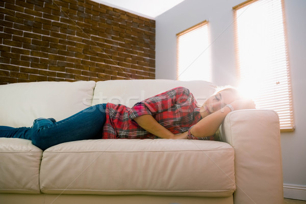 Pretty blonde napping on couch Stock photo © wavebreak_media