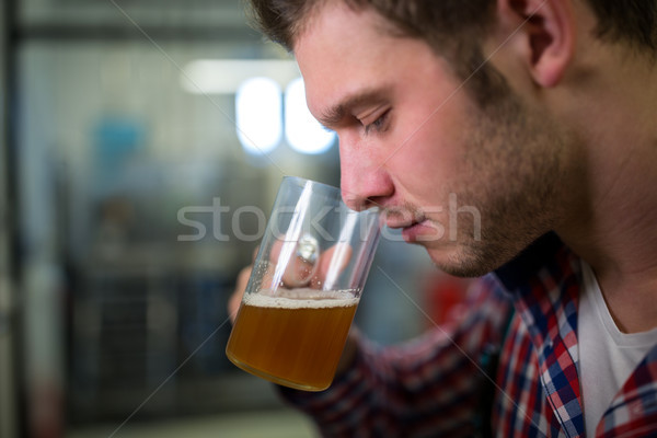 Stock photo: Brewer smelling beer