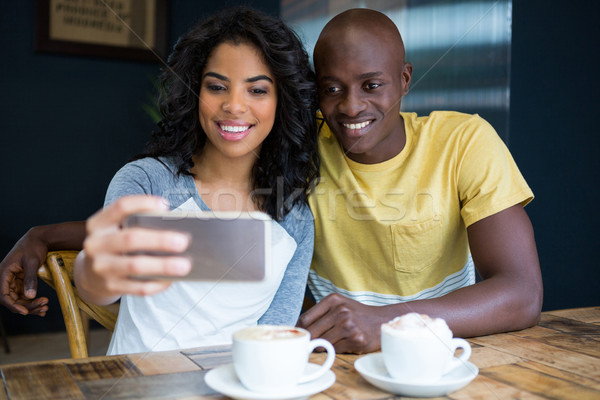 Stockfoto: Paar · mobieltje · coffeeshop · telefoon · gelukkig