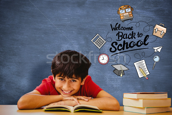 Composite image of portrait of boy reading book in library Stock photo © wavebreak_media