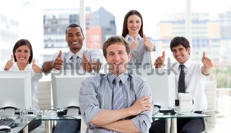 Stock photo: Lively business people with thumbs up