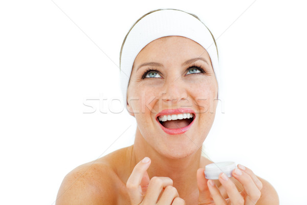 Beautiful woman applying lip balm Stock photo © wavebreak_media