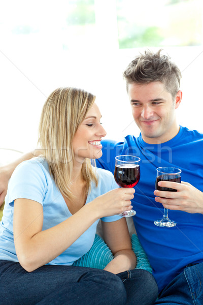 Adorable couple drinking wine together in the living-room  Stock photo © wavebreak_media