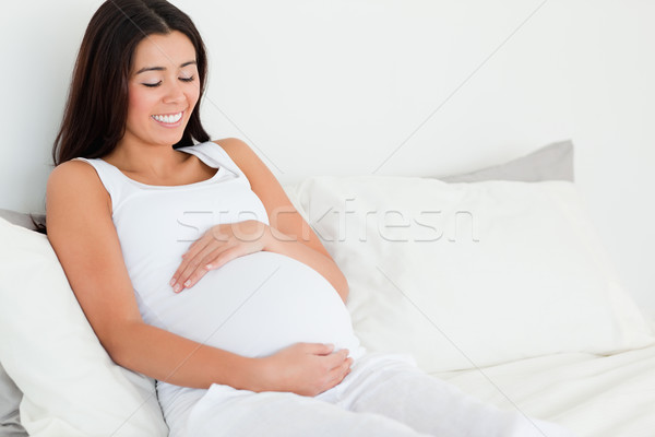 Görmek çekici hamile kadın dokunmak göbek yatak Stok fotoğraf © wavebreak_media