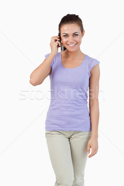 Stockfoto: Glimlachend · jonge · vrouwelijke · telefoon · witte · mode