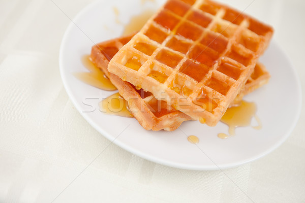 Waffles spread with honey on a table Stock photo © wavebreak_media