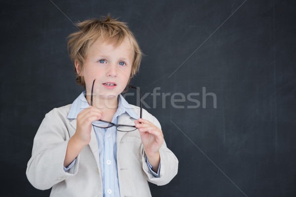 Boy dressed as teacher in front of black board Stock photo © wavebreak_media