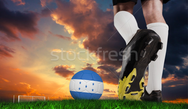 Stock photo: Composite image of football boot kicking honduras ball 