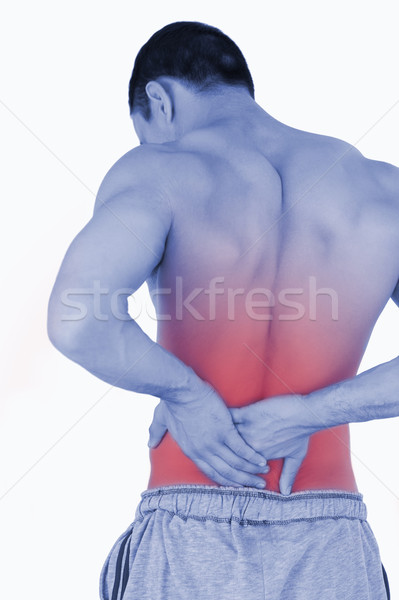 Young male suffering from back pain Stock photo © wavebreak_media