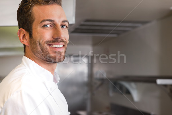 Cheerful young chef looking at camera Stock photo © wavebreak_media