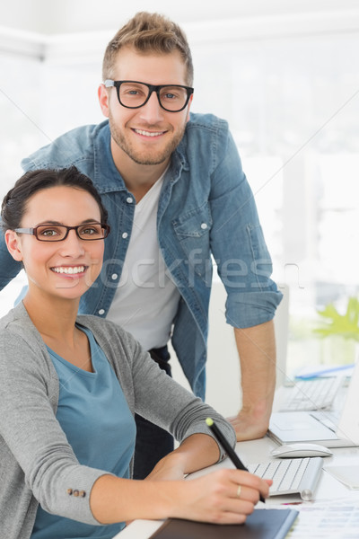 Young attractive design team at desk smiling at camera Stock photo © wavebreak_media