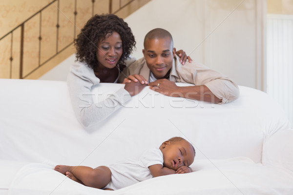 Adorable baby boy sleeping while being watched by parents Stock photo © wavebreak_media