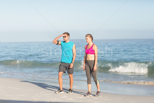Sporting couple looking far away Stock photo © wavebreak_media