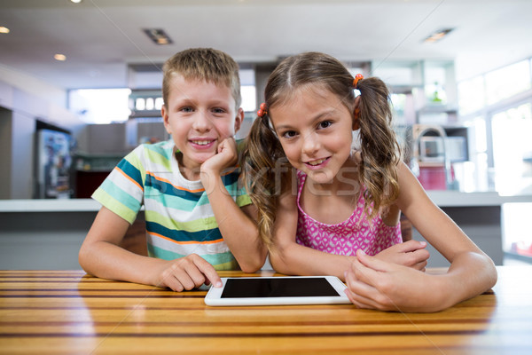 Happy sibling with digital tablet in kitchen Stock photo © wavebreak_media