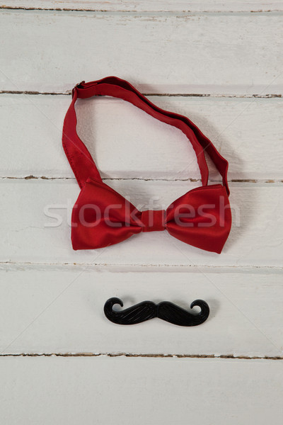 Overhead view of bow tie and mustache on white table Stock photo © wavebreak_media