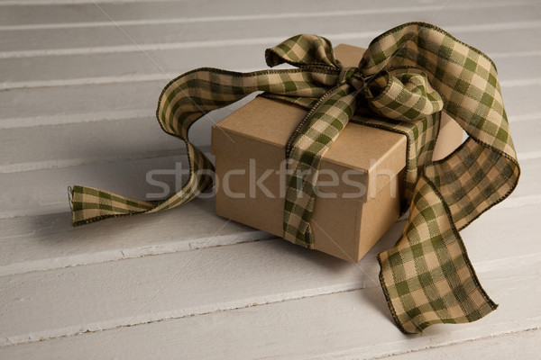 Tied gift box on wooden plank Stock photo © wavebreak_media