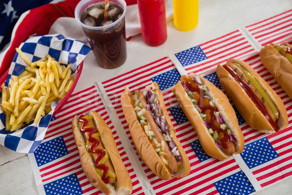 American flag and hot dogs on wooden table Stock photo © wavebreak_media