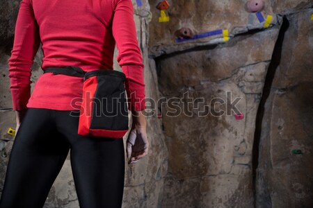Determined woman practicing rock climbing Stock photo © wavebreak_media