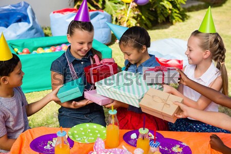 Kids using digital tablet during birthday party Stock photo © wavebreak_media