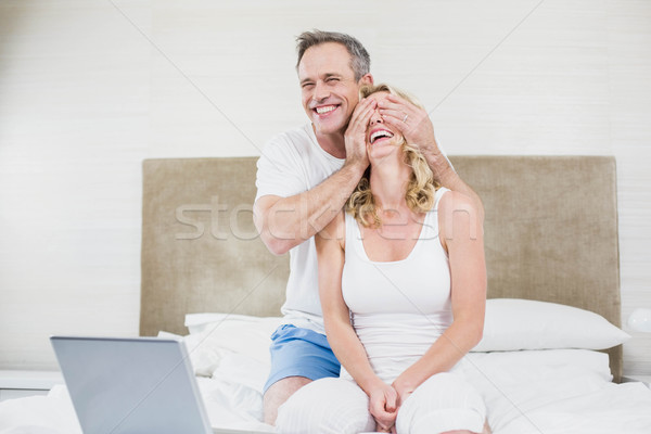 Husband making a surprise to wife Stock photo © wavebreak_media