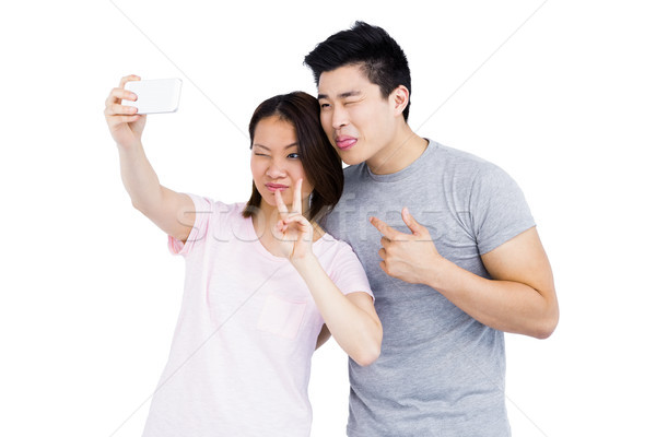 Young couple taking a selfie on smartphone Stock photo © wavebreak_media
