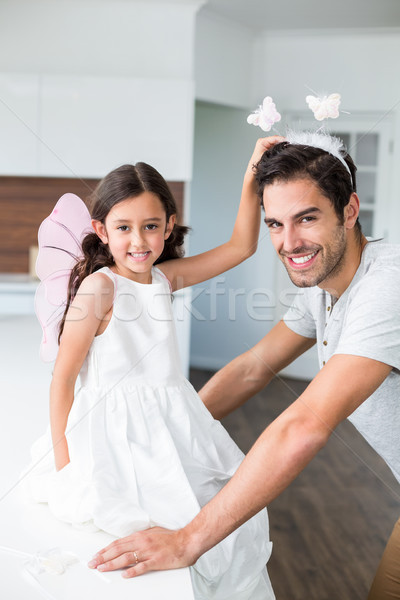 Portrait of smiling father with butterfly headband and daughter  Stock photo © wavebreak_media