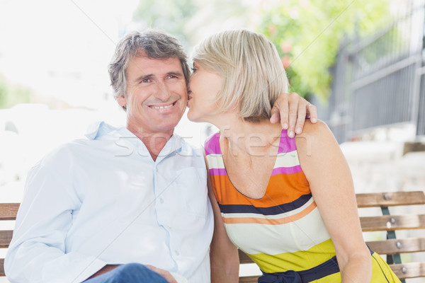 Blonde hair woman kissing man in park Stock photo © wavebreak_media