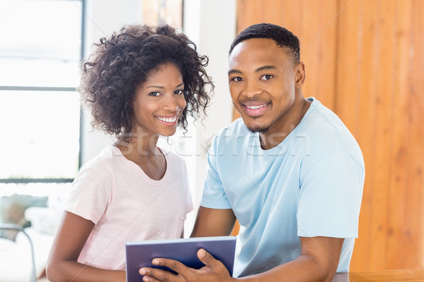 Happy couple using digital tablet Stock photo © wavebreak_media