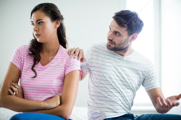 Stock photo: Couple arguing with each other in bedroom