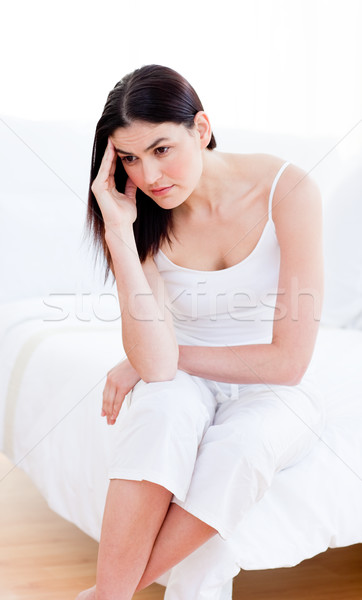 Portrait of a unhappy woman sitting on bed Stock photo © wavebreak_media