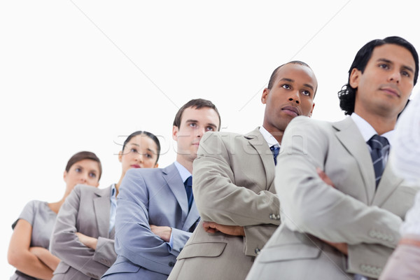 Low-angle shot of a business team crossing their arms in a single line against white background Stock photo © wavebreak_media