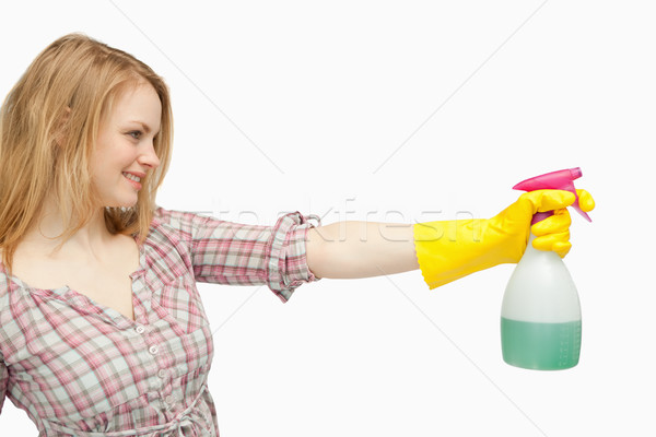 Blond-haired woman holding a spray bottle Stock photo © wavebreak_media