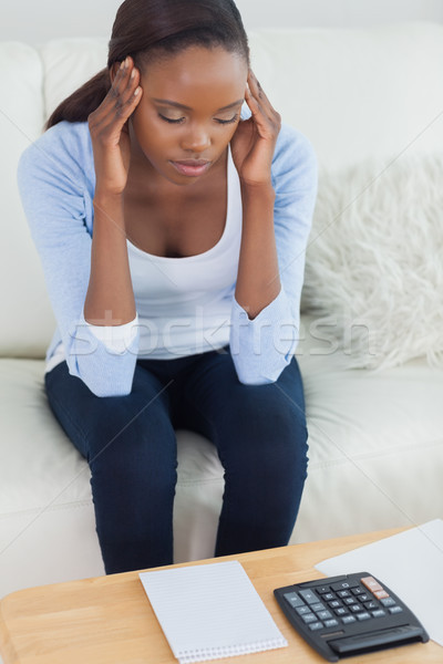 Black woman having a headache in a living room Stock photo © wavebreak_media